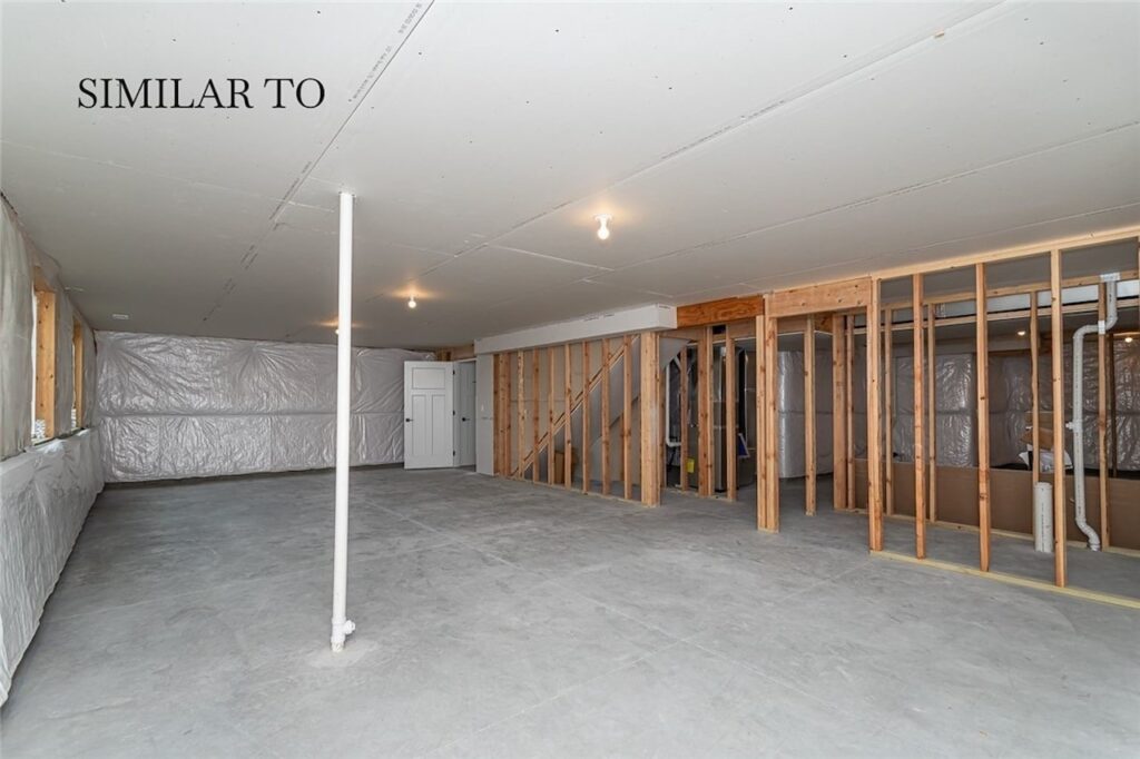 Unfurnished room with drywall walls and ceiling, showcasing new Gladiator Homes available at 308 S Valley View Dr, Norwalk, IA