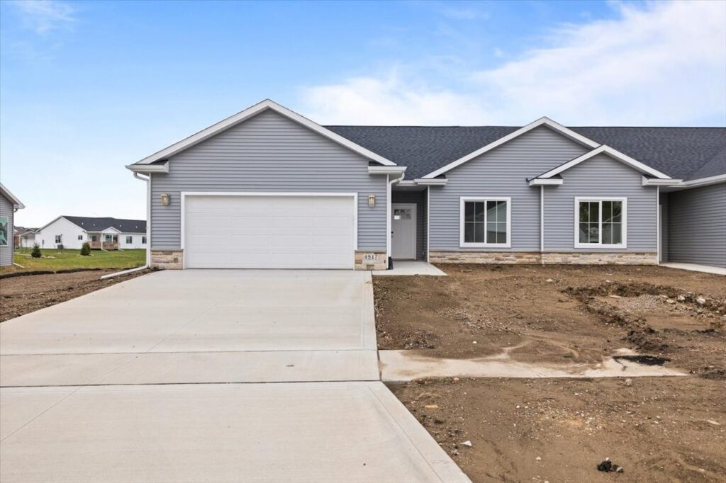 Exterior view of a new Gladiator home at 4517 NW 17th St, Ankeny, IA, showcasing a driveway and attached garage.