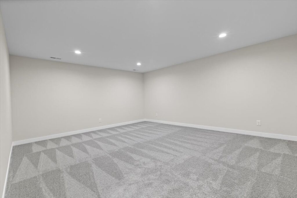 Unfurnished room with a ceiling fan and window, located in the New Gladiator home for sale at 4517 NW 17th St, Ankeny, IA.