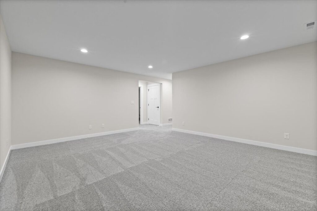 Unfurnished room with a ceiling fan and window, located in the New Gladiator home for sale at 4517 NW 17th St, Ankeny, IA.