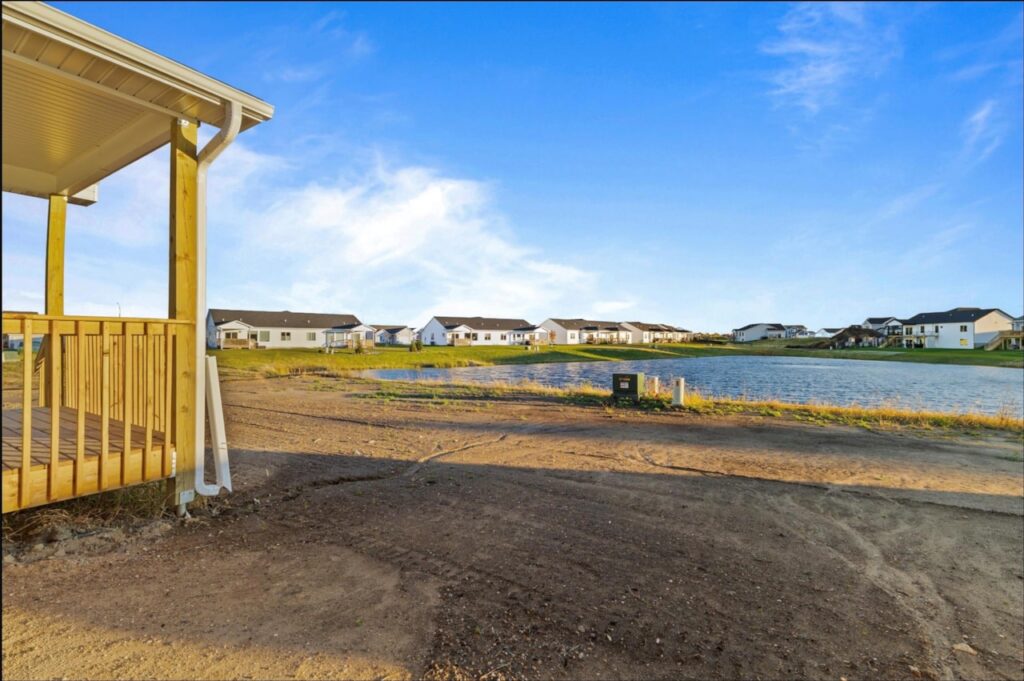 New Gladiator home for sale at 4517 NW 17th St, Ankeny, IA, featuring a spacious pond in the background.