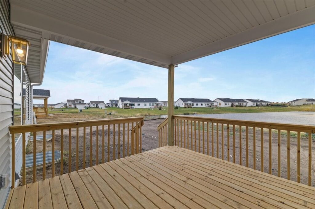 Scenic lake view from a porch, highlighting the tranquil setting of the New Gladiator home for sale at 4517 NW 17th St, Ankeny, IA.