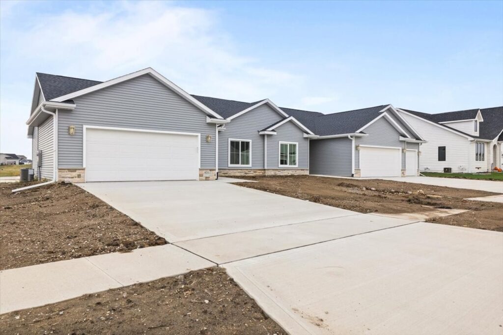 Exterior view of a new Gladiator home at 4517 NW 17th St, Ankeny, IA, showcasing a driveway and attached garage.