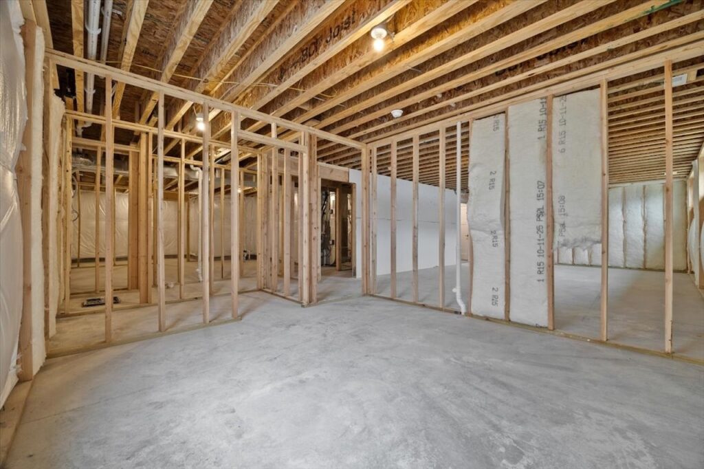 Unfurnished room featuring drywall walls and ceiling, listed among homes for sale at 321 11th St NW, Bondurant, IA.