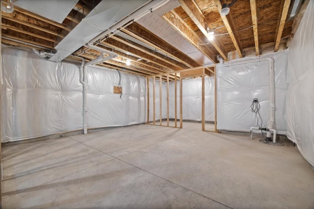 Unfurnished room featuring drywall walls and ceiling, listed among homes for sale at 321 11th St NW, Bondurant, IA.