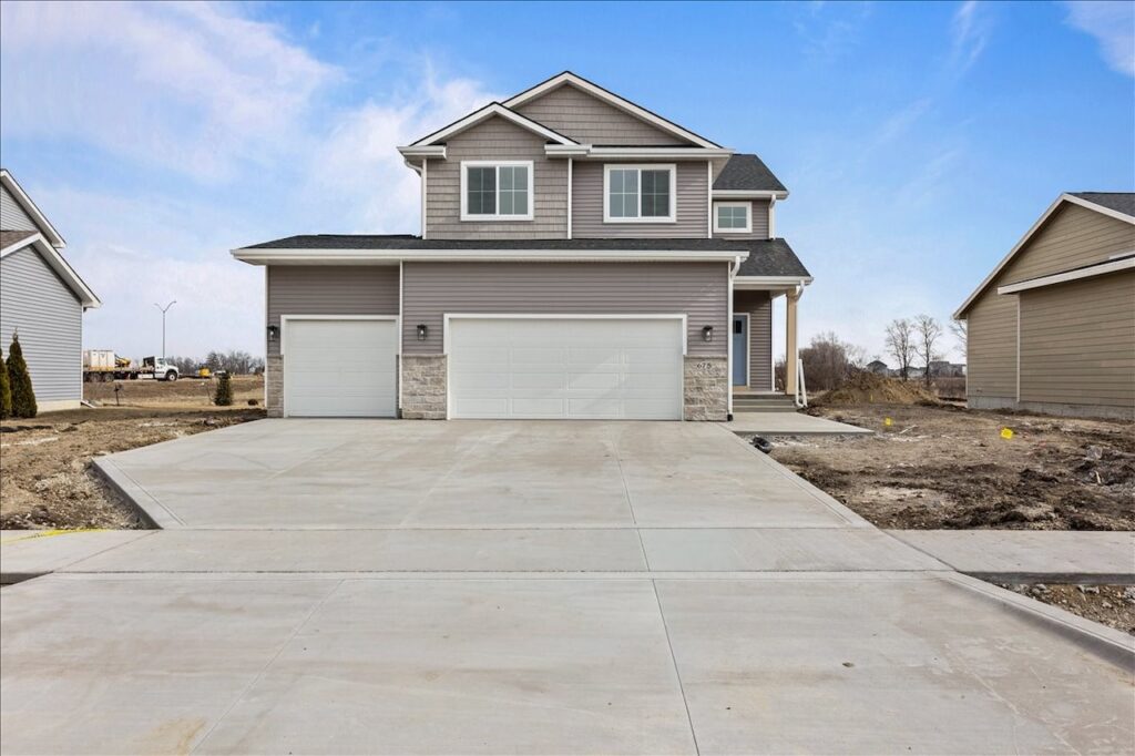 Available home at 675 NW Rosemont Dr, Waukee, IA, showcasing a driveway and garage in the front