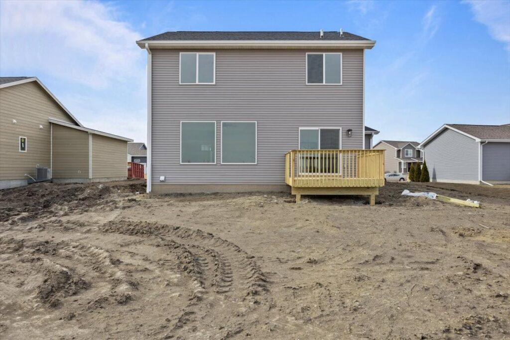 House for sale at 675 NW Rosemont Dr, Waukee, IA, featuring a dirt lot and driveway. Listed by Gladiator HOMES.